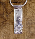 Textile-themed pendant