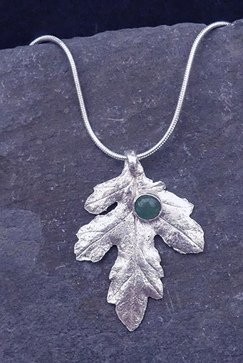 Chrysanthemum pendant with jade